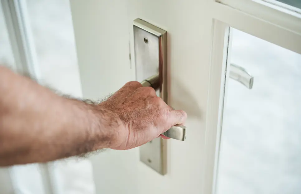 Security door replacement with a homeowner replacing a door lock in Dandenong